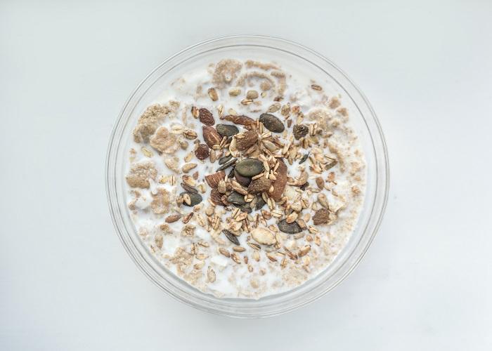 A bowl of oatmeal, suggesting considerations about its suitability for cats' consumption